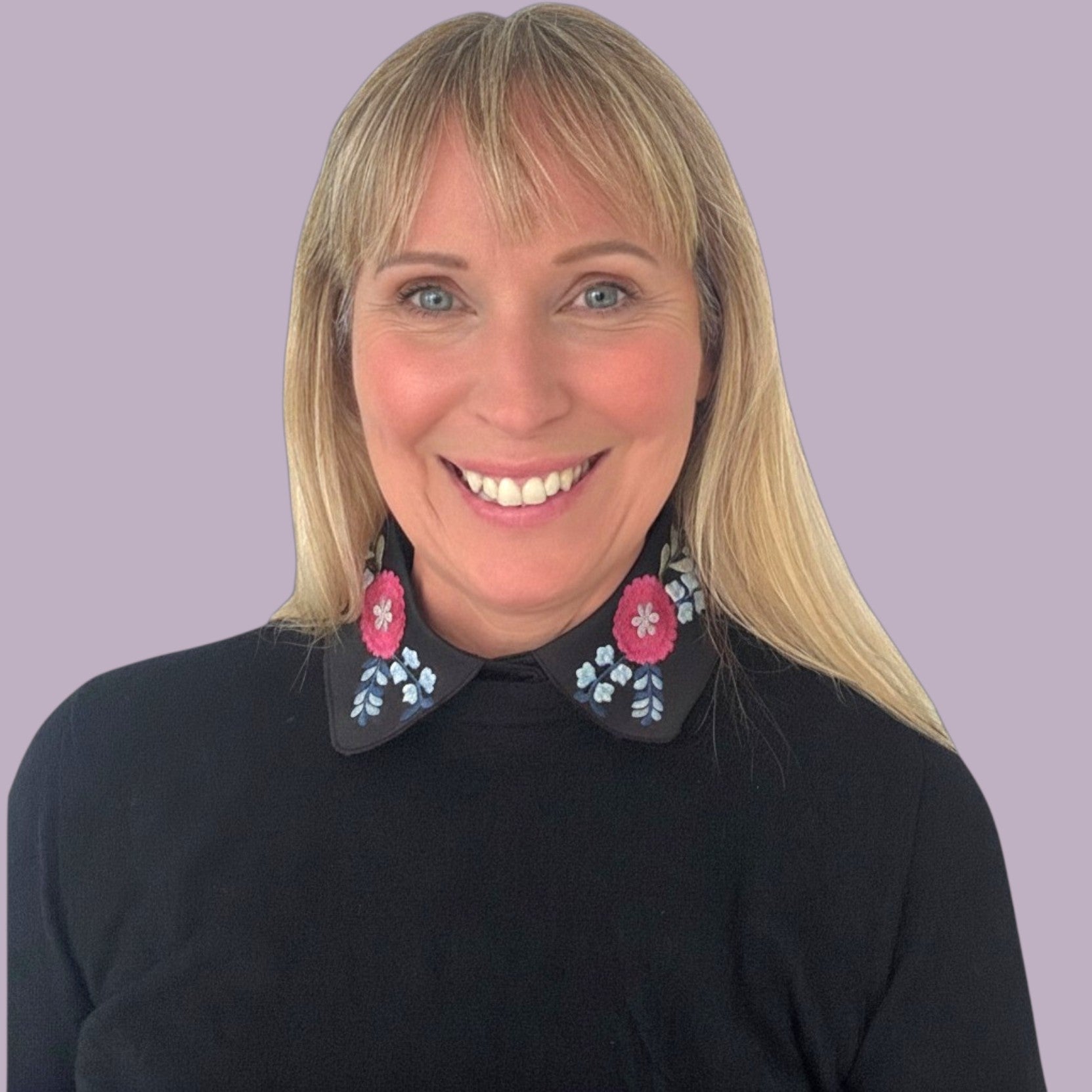 Simply Collars black detachable collar with vibrant pink and blue floral embroidery. Adds polish without bulk.