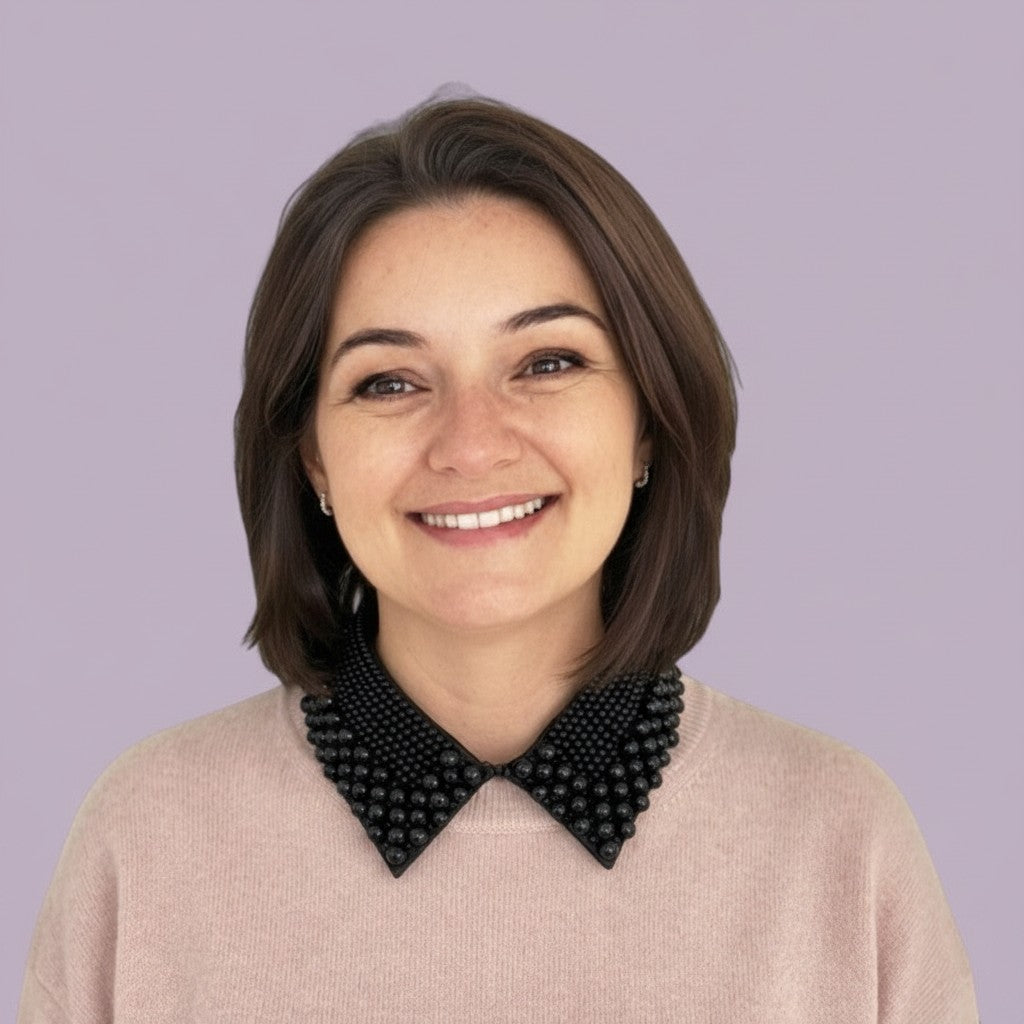 Simply Collars Vintage Pearl black embellished detachable collar accessory with glossy beads on a woman wearing a pink sweater.