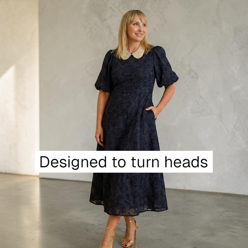 Simply Collars Petra Pan detachable champagne collar with pearls and crystals. Worn by a model in a navy dress.