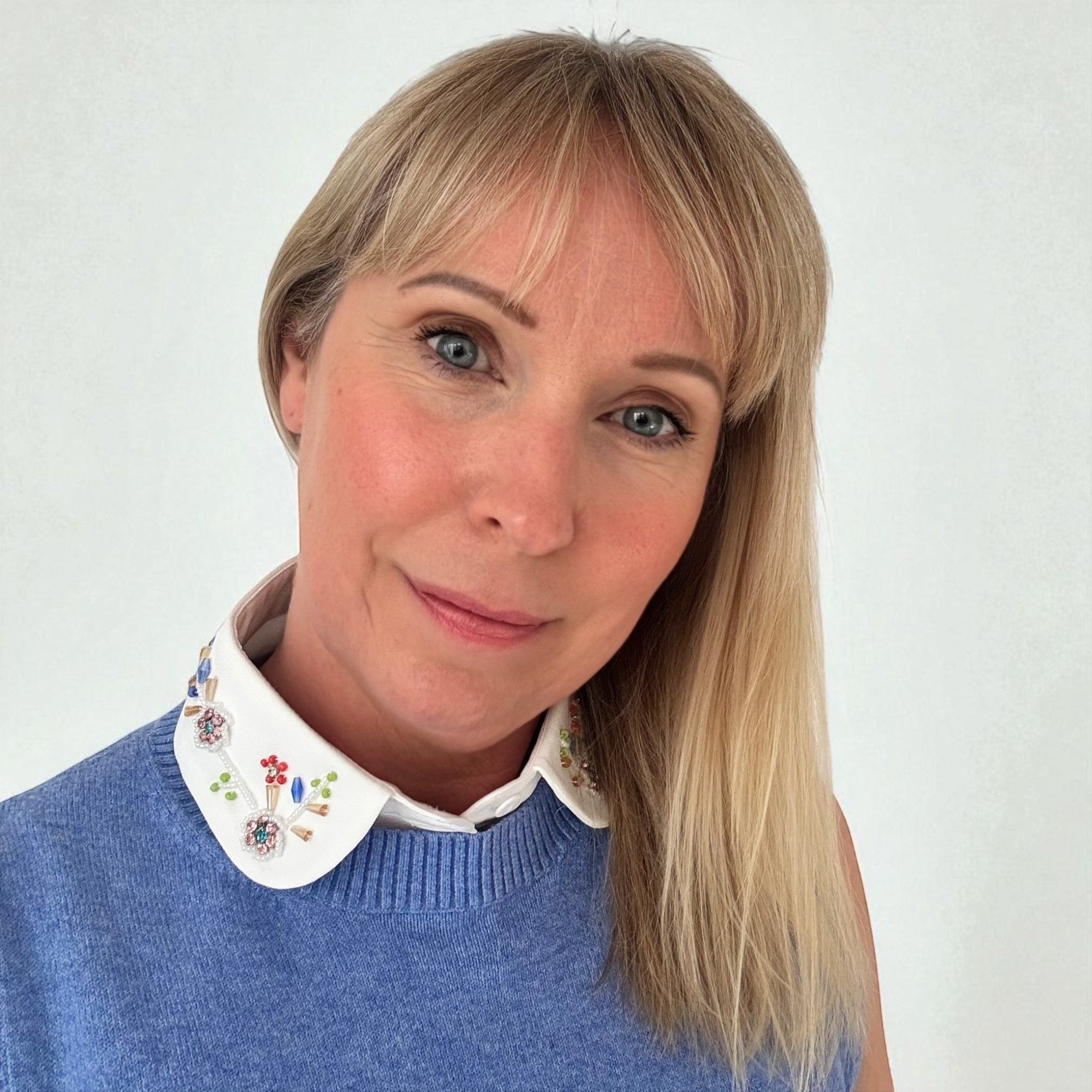 Simply Collars white detachable collar with vibrant floral beadwork and colourful accents.
